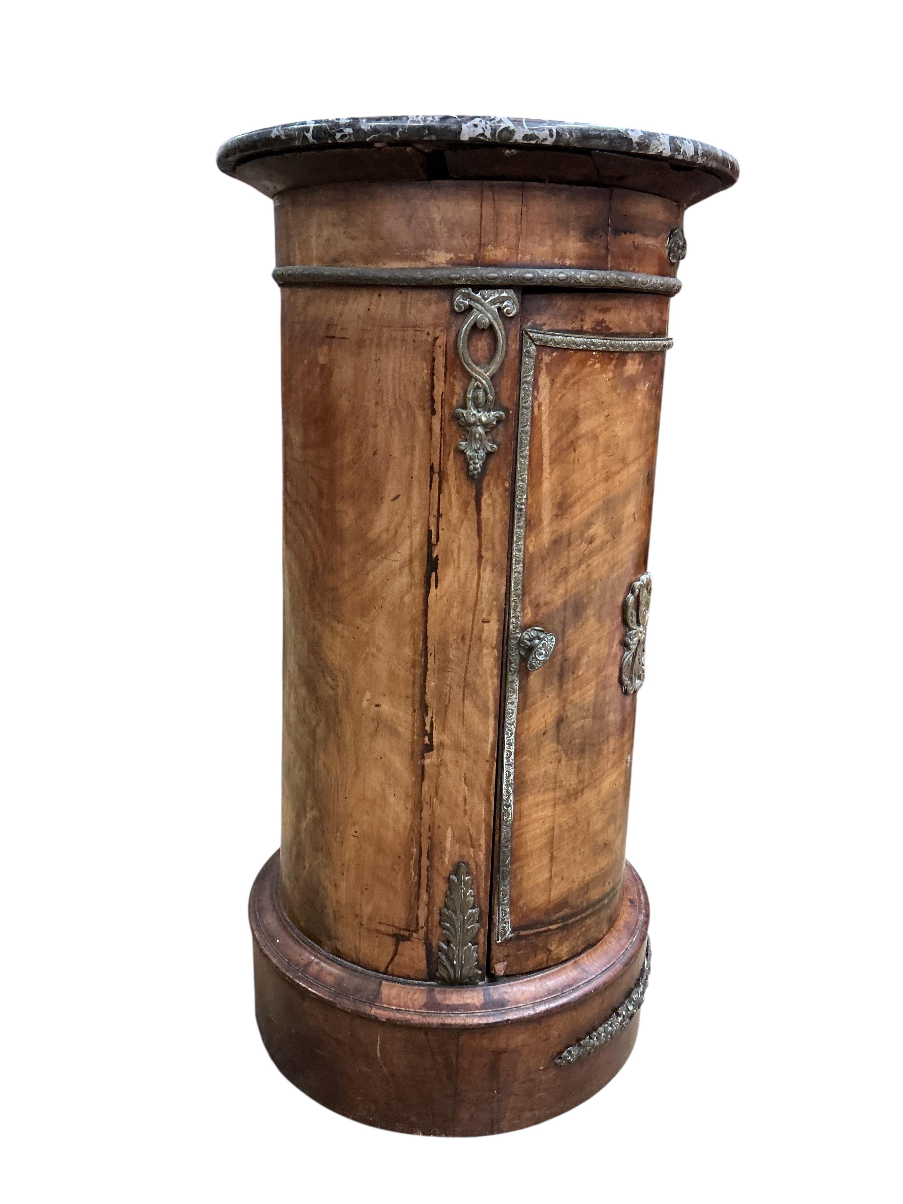 A 19th century French ormolu mounted mahogany cylindrical pot cupboard, with dished grey marble top, diameter 40cm, height 75cm